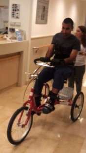  Shai Siman Tov exercising on a tricycle in the department