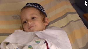 the 4 years old child in his hospital bed