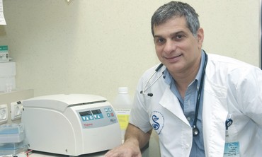 a doctor next to a machine
